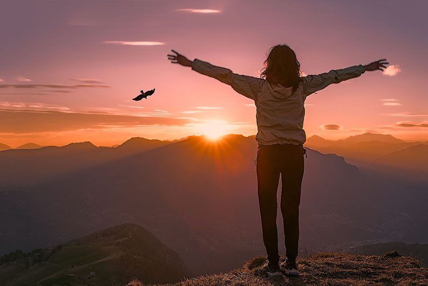 Woman on top of the mountain